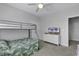 Well-lit bedroom with a bunk bed, dresser, and TV at 6 Cottage Dr., Murrells Inlet, SC 29576
