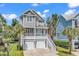 Two-story home with gray siding, two-car garage, and front porch at 6 Cottage Dr., Murrells Inlet, SC 29576