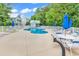 Community pool with plenty of lounge chairs and umbrellas at 6 Cottage Dr., Murrells Inlet, SC 29576