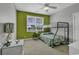 Bright bedroom with a bunk bed and an accent wall at 6 Cottage Dr., Murrells Inlet, SC 29576