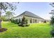 Landscaped backyard with a large covered patio at 1012 Maccoa Dr., Conway, SC 29526
