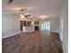 Open living room and kitchen with hardwood floors and stainless steel appliances at Tbd 4 Casey Dr., Nichols, SC 29581