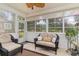 Bright sunroom with wicker furniture and plenty of natural light at 355 Foxtail Dr., Longs, SC 29568