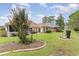 Expansive backyard showcasing manicured lawn and garden features at 355 Foxtail Dr., Longs, SC 29568