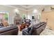 Spacious living room with a fireplace and access to a sunroom at 355 Foxtail Dr., Longs, SC 29568
