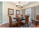 Bright dining room with hardwood floors and a large window at 355 Foxtail Dr., Longs, SC 29568