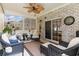Relaxing sunroom, wicker furniture, and access to the backyard at 355 Foxtail Dr., Longs, SC 29568