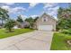 Attached garage with driveway and landscaping at 355 Foxtail Dr., Longs, SC 29568