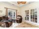 Sunroom with comfortable seating and access to backyard at 355 Foxtail Dr., Longs, SC 29568