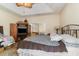 King bedroom with sliding doors to a patio and a large TV at 355 Foxtail Dr., Longs, SC 29568