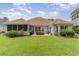 Large backyard with patio and screened porch at 355 Foxtail Dr., Longs, SC 29568