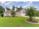 Brick house with attached garage and landscaped yard at 355 Foxtail Dr., Longs, SC 29568