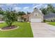 Brick house with a two-car garage and manicured lawn at 355 Foxtail Dr., Longs, SC 29568