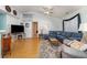 Cozy living room featuring a sectional sofa and hardwood floors at 6458 Sweet Gum Trail, Myrtle Beach, SC 29588