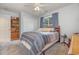 Bedroom with double bed, wooden dresser, and ceiling fan at 6458 Sweet Gum Trail, Myrtle Beach, SC 29588