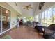 Spacious screened porch with patio furniture and view of backyard at 6458 Sweet Gum Trail, Myrtle Beach, SC 29588