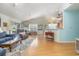 Open living room and dining area with hardwood floors at 6458 Sweet Gum Trail, Myrtle Beach, SC 29588