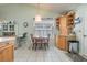 Cozy kitchen nook with a round table and chairs, built in cabinetry, and window at 6458 Sweet Gum Trail, Myrtle Beach, SC 29588