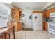 Bright kitchen with wood cabinets, white appliances, and an eat-in area at 6458 Sweet Gum Trail, Myrtle Beach, SC 29588