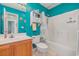 Clean bathroom with teal walls and a tub shower at 6458 Sweet Gum Trail, Myrtle Beach, SC 29588