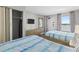 Bright bedroom featuring two twin beds and ocean views at 1501 S Ocean Blvd. # 1235, Myrtle Beach, SC 29577