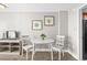 Small dining area with white table and chairs at 1501 S Ocean Blvd. # 1235, Myrtle Beach, SC 29577