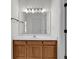 Bathroom with wood vanity, tiled floor, and a large mirror above the sink at 211 Cedar Ridge Ln., Conway, SC 29526