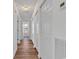 Hallway with light wood-look vinyl plank flooring and ample closet space at 211 Cedar Ridge Ln., Conway, SC 29526