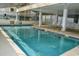 Relaxing indoor pool area with lounge chairs and large windows at 6108 N Ocean Blvd. N, North Myrtle Beach, SC 29582