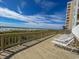 Beachfront deck with lounge chairs and ocean view at 6108 N Ocean Blvd. N, North Myrtle Beach, SC 29582