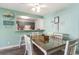 Bright dining area with glass-top table and beachy decor at 202 75Th Ave N # 5706/5707, Myrtle Beach, SC 29572