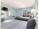 Bedroom with two double beds, balcony access, and ocean view at 202 75Th Ave N # 5706/5707, Myrtle Beach, SC 29572