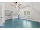 Spacious bedroom with light blue floors and a window view at 4842 Main St. N, Loris, SC 29569