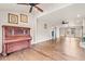 Spacious living room with hardwood floors and antique piano at 4842 Main St. N, Loris, SC 29569