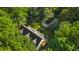 Aerial view showing house, backyard, and surrounding trees at 3758 Loblolly Ave., Little River, SC 29566