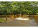Spacious deck overlooking a wooded backyard at 3758 Loblolly Ave., Little River, SC 29566
