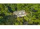 Aerial view of house nestled in a wooded area, showcasing its size and curb appeal at 3758 Loblolly Ave., Little River, SC 29566