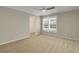 Spacious bedroom with neutral walls, carpet, ceiling fan, and walk-in closet at 3758 Loblolly Ave., Little River, SC 29566