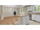 Eat-in kitchen with island, stainless steel appliances, and laundry access at 3758 Loblolly Ave., Little River, SC 29566