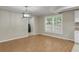 Simple dining area with hardwood floors and laundry room access at 3758 Loblolly Ave., Little River, SC 29566