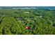 Wide aerial showcasing home's location in a wooded neighborhood at 3758 Loblolly Ave., Little River, SC 29566