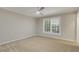 Bright bedroom featuring neutral walls, carpet, ceiling fan and window with shutters at 3758 Loblolly Ave., Little River, SC 29566