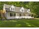 Two story home with wrap around porch and detached garage at 3758 Loblolly Ave., Little River, SC 29566