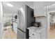 Stainless steel refrigerator and white cabinets with quartz countertops at 6001 - 1864A S Kings Hwy., Myrtle Beach, SC 29575