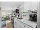 Kitchen with white cabinets, quartz countertops and stainless steel appliances at 6001 - 1864A S Kings Hwy., Myrtle Beach, SC 29575