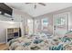 King-size bedroom with a mounted TV, built-in shelves, and access to a deck at 6001 - 1864A S Kings Hwy., Myrtle Beach, SC 29575