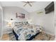 King-size bed, ceiling fan, and mounted TV in a bright bedroom at 6001 - 1864A S Kings Hwy., Myrtle Beach, SC 29575