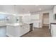 Modern kitchen with white cabinets, quartz countertops, and stainless steel appliances at 357 Glacier Way, Conway, SC 29526
