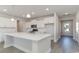 Modern kitchen with white cabinets, quartz countertops, and stainless steel appliances at 357 Glacier Way, Conway, SC 29526