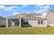 Two-story house with beige siding and screened porch at 357 Glacier Way, Conway, SC 29526